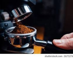 Barista at espresso machine